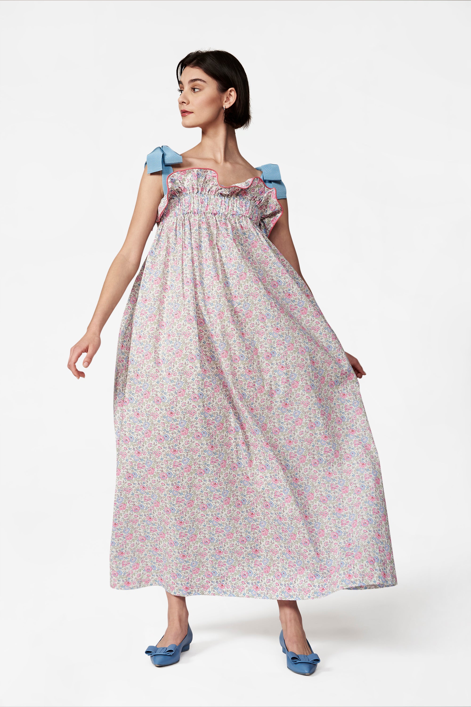 Blue and pink tiny floral-print dress with blue ribbon straps tied in a bow at the shoulders