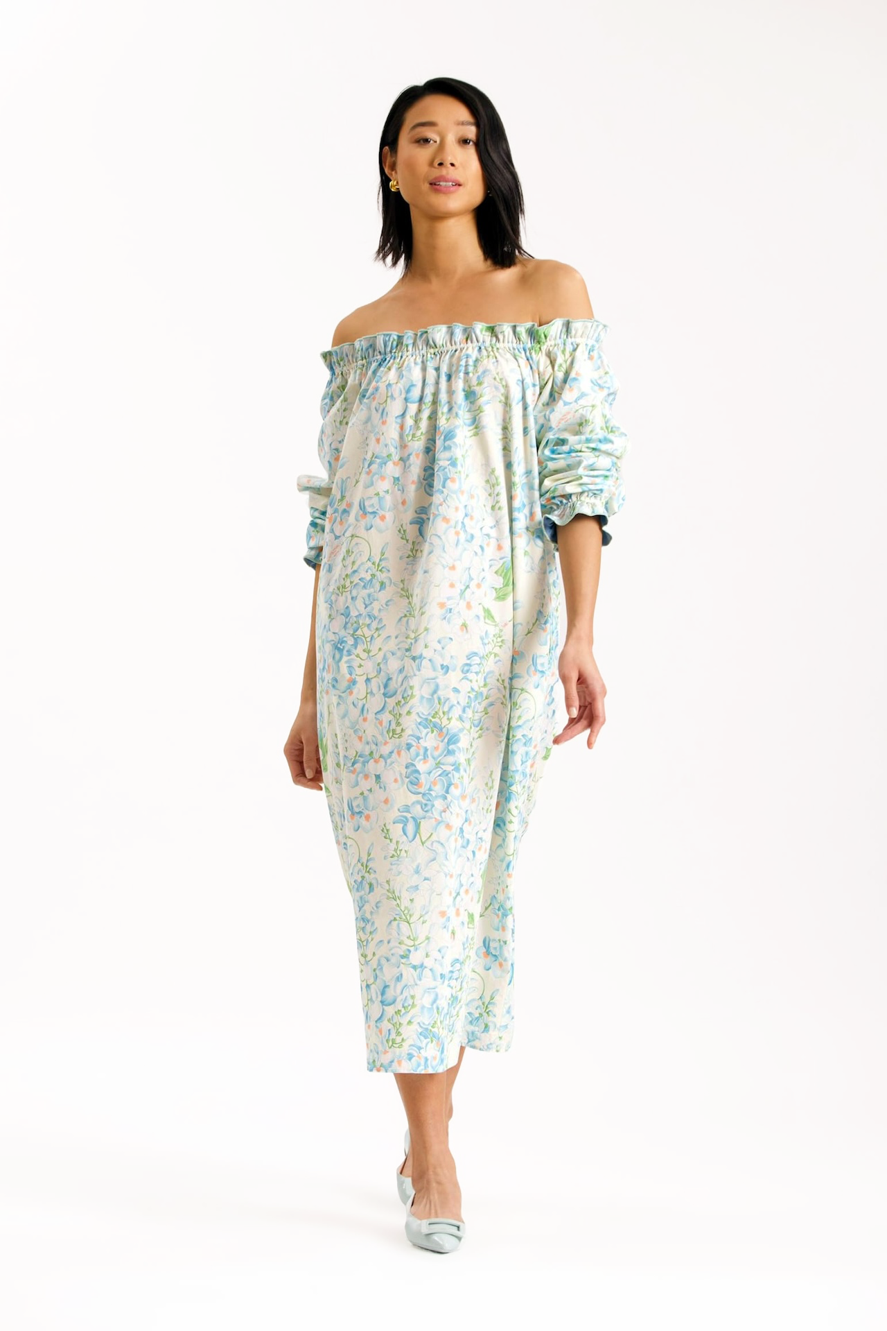 Casey Marks Grace dress blue chintz pattern. Elasticated neckline and wrists with small ruffle. Can be worn on or off shoulders.